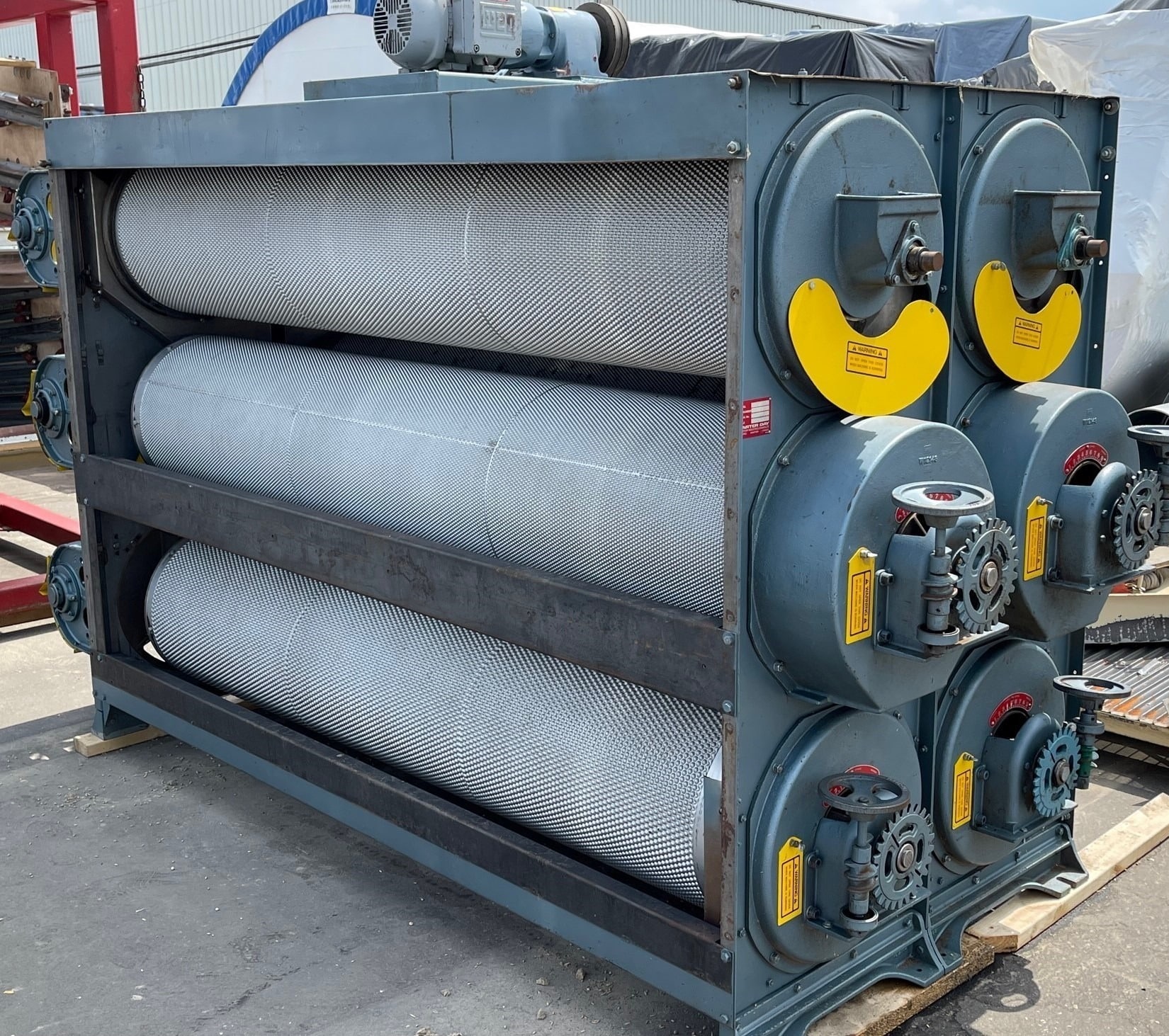 Carter Day Uniflow indent separator stacked three cylinders high with the covers removed, showing the indented steel cylinders