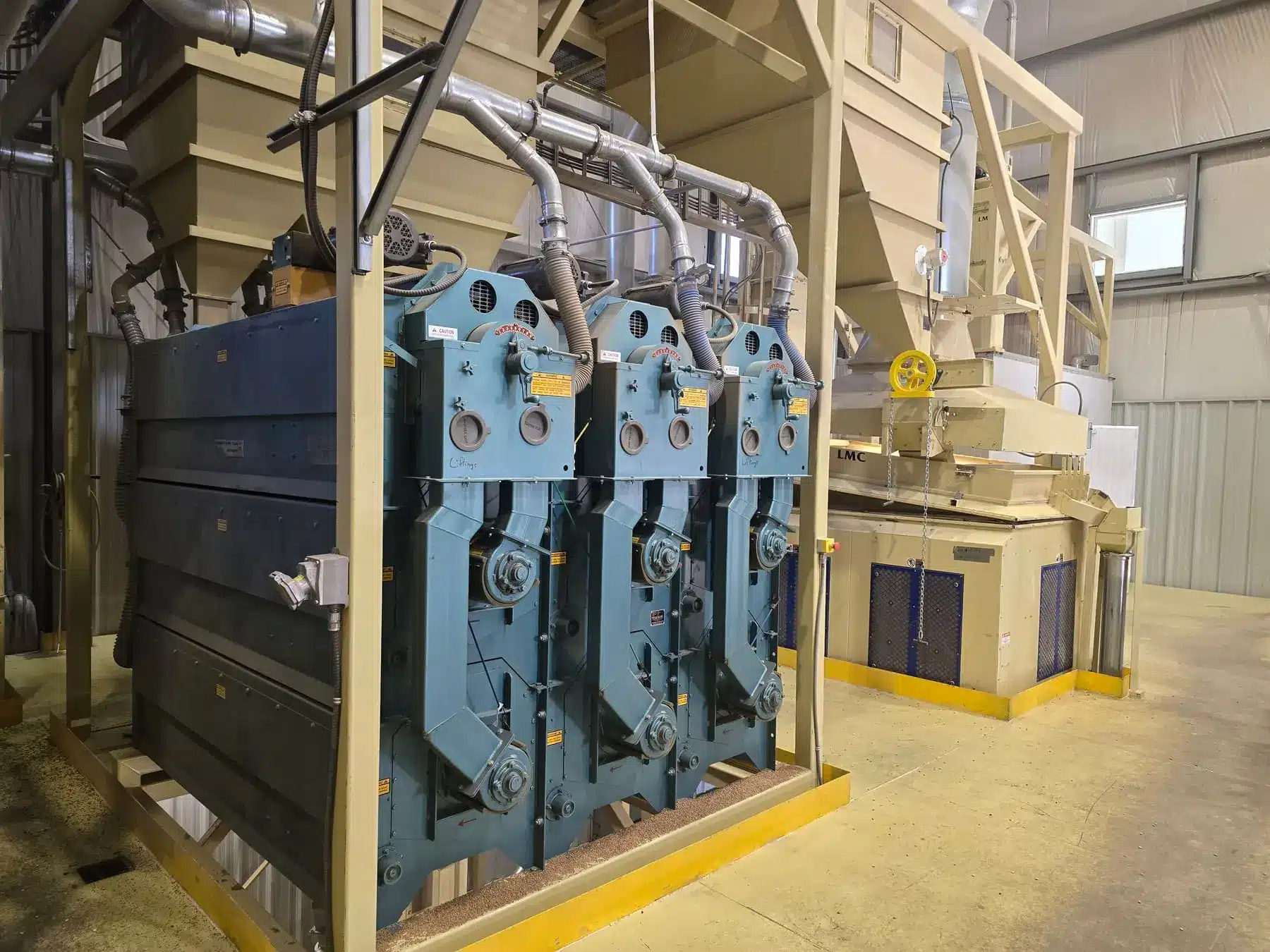 Carter Day Uniflow indent separator installed next to an LMC Roca Destoner at the Galloway Seeds cleaning plant in Fort Saskatchewan, Alberta
