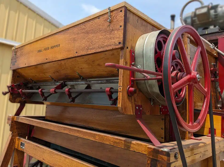 Roll feed hopper and red drive pulley on the reconditioned Clipper Super 228D